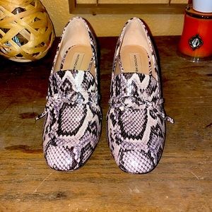 Amazing snake skin heeled loafers.